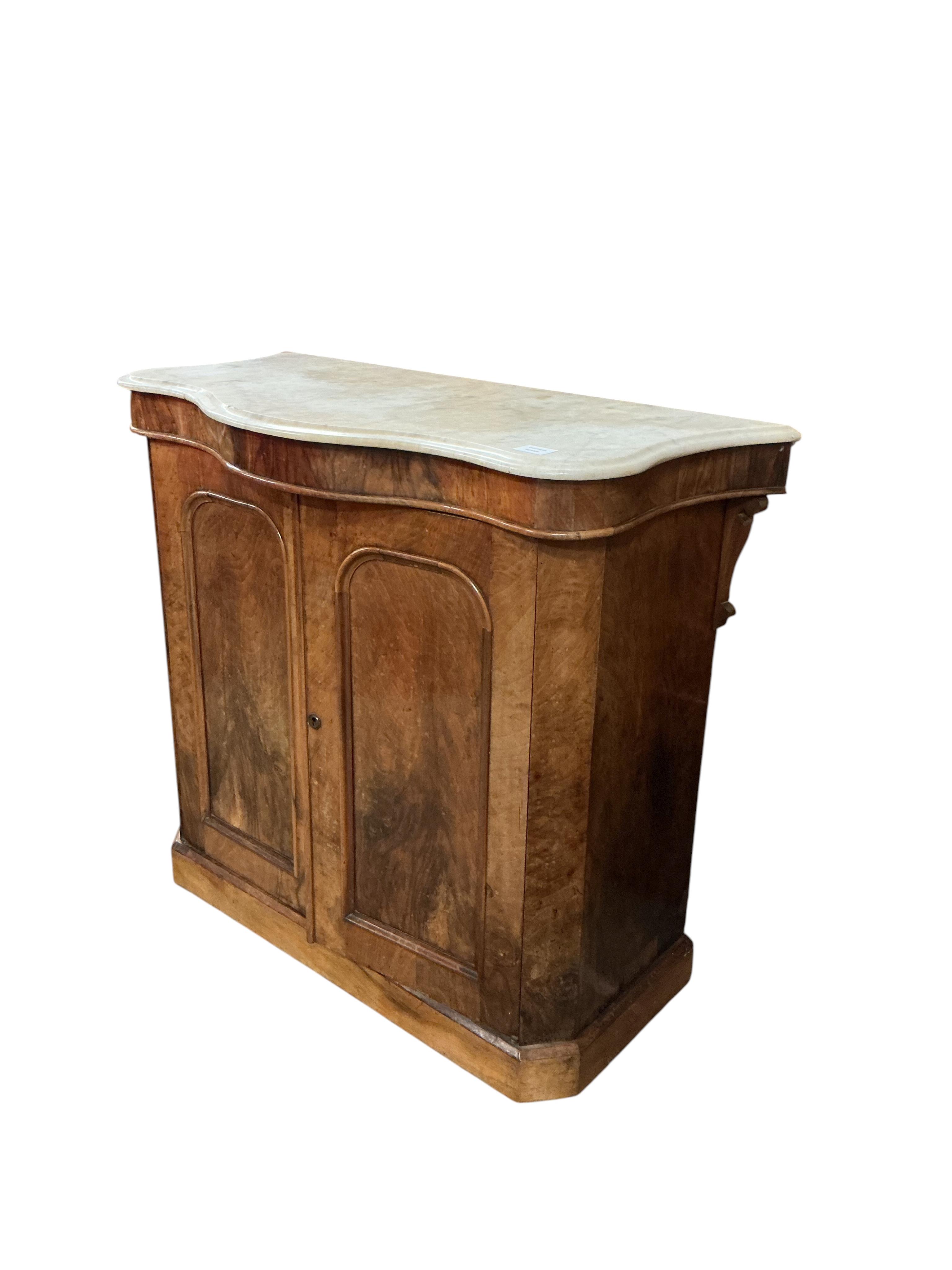 A Victorian walnut serpentine front marble top side cabinet, width 99cm, depth 46cm, height 87cm